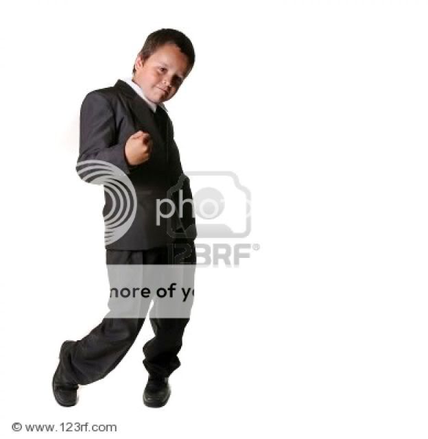 1216013-young-boy-dressed-in-a-tuxedo.jpg
